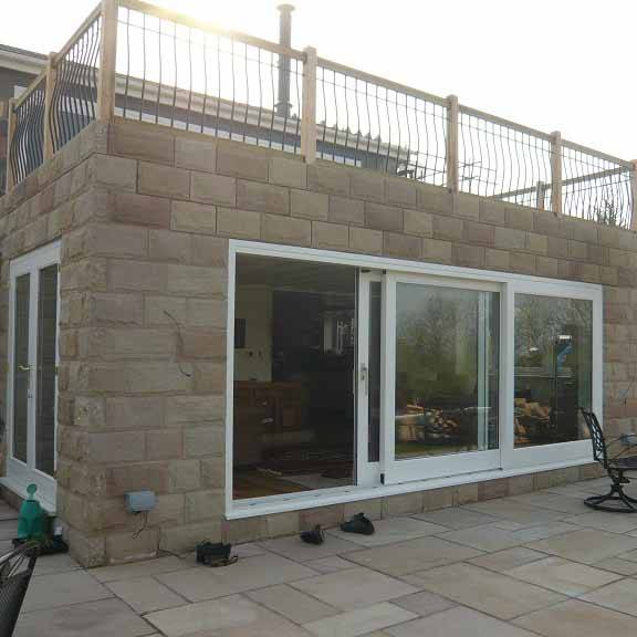 Timber Lift and Slide Doors - The Peveril - Wooden Entrance Doors