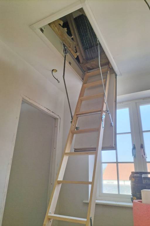 Timber loft ladder provides access to solar inverters in new-build ...