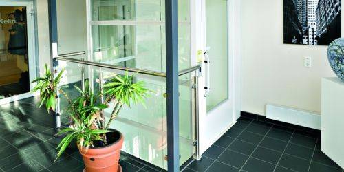 Aritco 7000 Passenger Platform Lift - Through Car Entry and Exit Doors, with Glass Lift Shaft