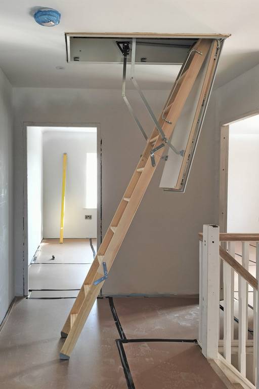 Timber loft ladder provides access to solar inverters in new-build ...