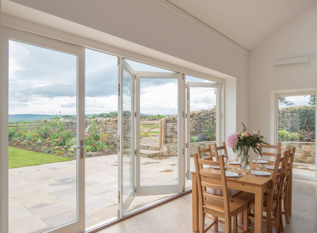 Timber Bifold Doors - with a Low Profile Aluminium Threshold for Smooth Transition