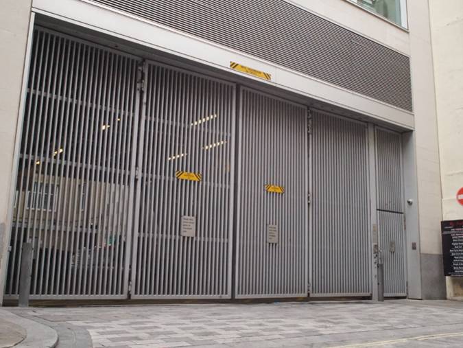 CSG 10601 Overhead Tracked Bi-Folding Security Gate - Security Gate