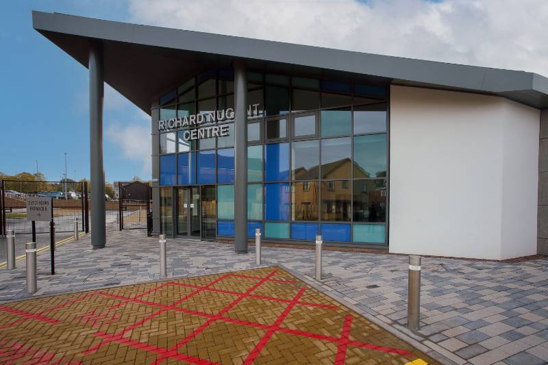 Elliptical metal column casings for Wednesbury health centre.