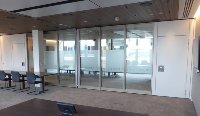 Dorma Variflex 100 semi automatic moveable wall combines with glass semi automatic wall and skyfold acoustic folding wall in London offices of Anglo American