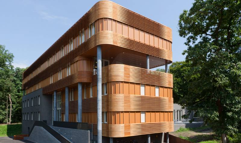 Curved Accoya Cladding and Shading for a 1960s Building