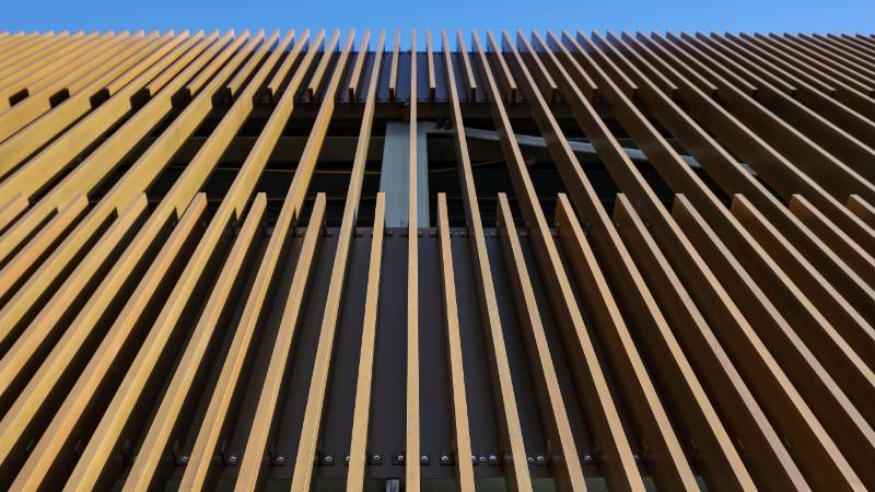 Wood finish solar shading on aluminium