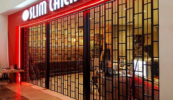 Slim Chickens Sliding Shutters at Arndale Shopping Centre, Manchester and Cribbs Causeway, Bristol