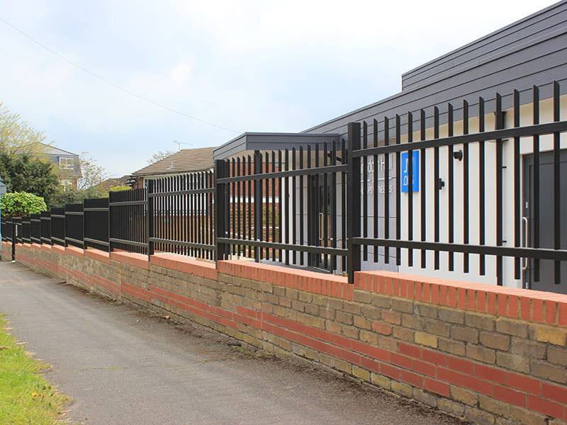 Wall top railings protect Kingdom Hall