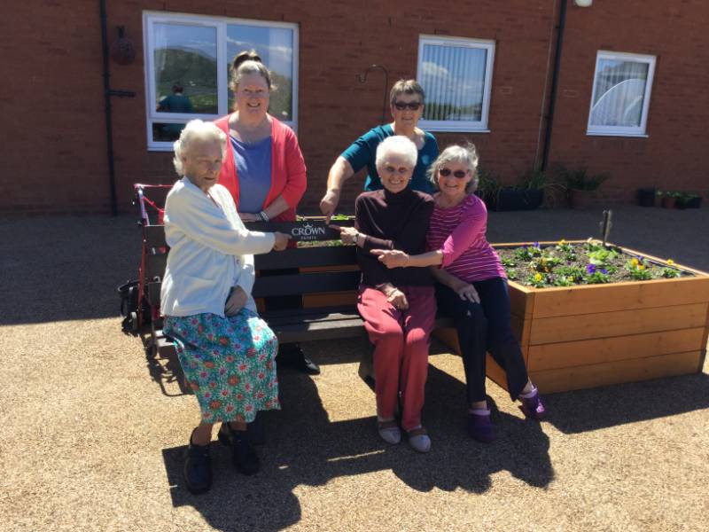 Crown Paints donates bench to sheltered housing scheme