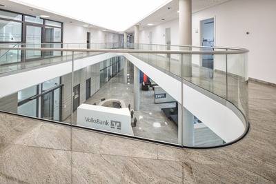 Curved and adjustable glass railing systems for German bank office