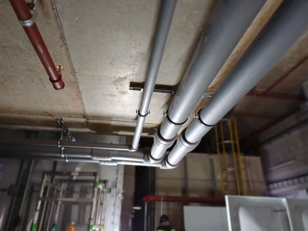 Water supply system installation within Towers D1 and D2 of Trinity Island Development.