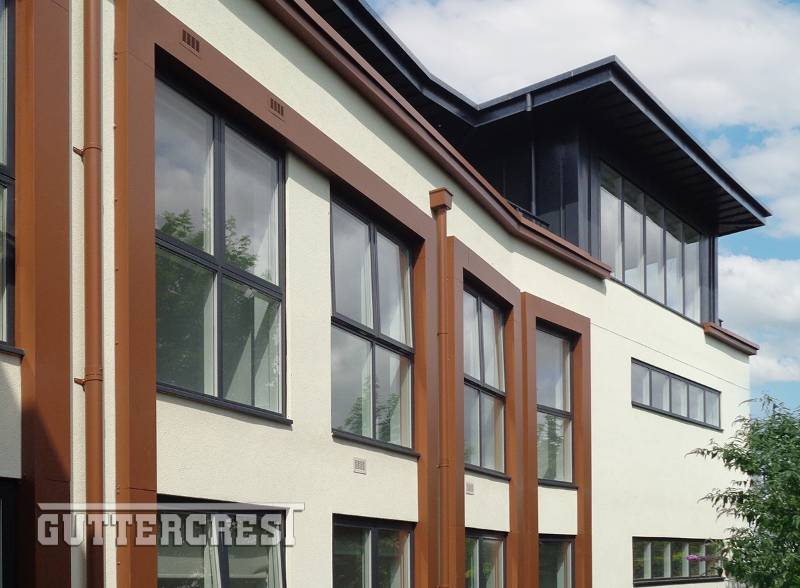 Round Downpipes and Hoppers compliment architectural lines on modern housing development