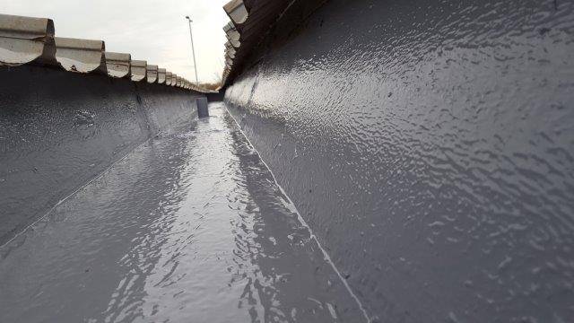 Liquid gutter lining system by Liquasil