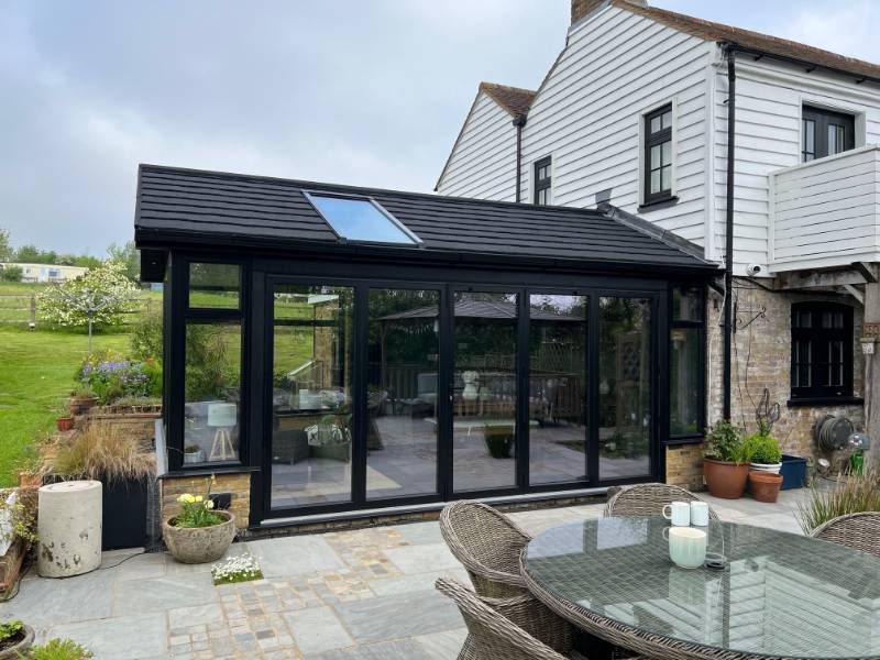 Taylorglaze Elevates Conservatory with SupaLite Roof and Stylish Black Aluminum Frames