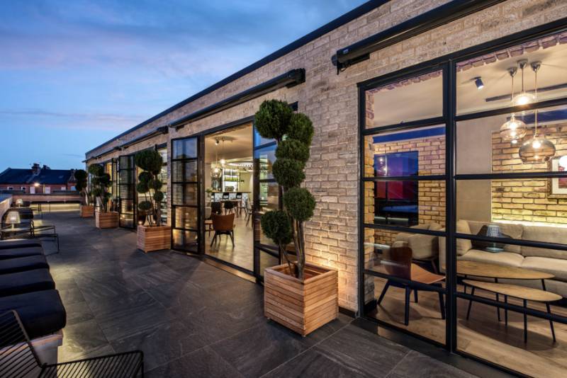 Clement steel screens create a sensational backdrop to roof terrace at iconic film studios