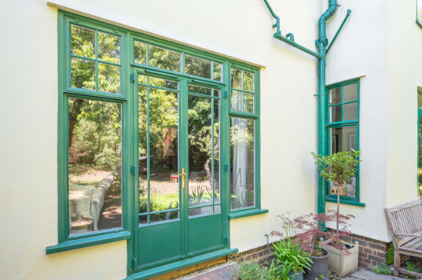 Bespoke green steel windows and doors for Art Deco style London home