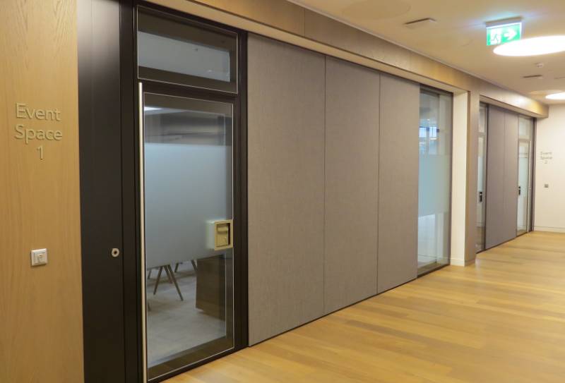 Skyfold fully automatic vertical rising Acoustic moveable wall specified as Style Upgrades Law Firm’s Partitions Again