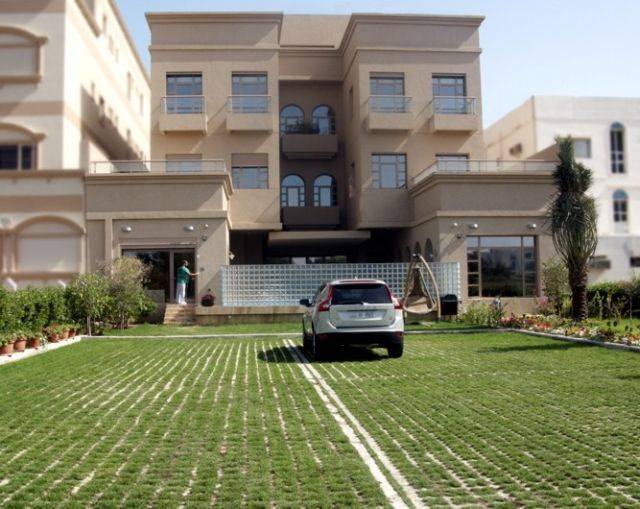 Concrete grass-filled paving systems