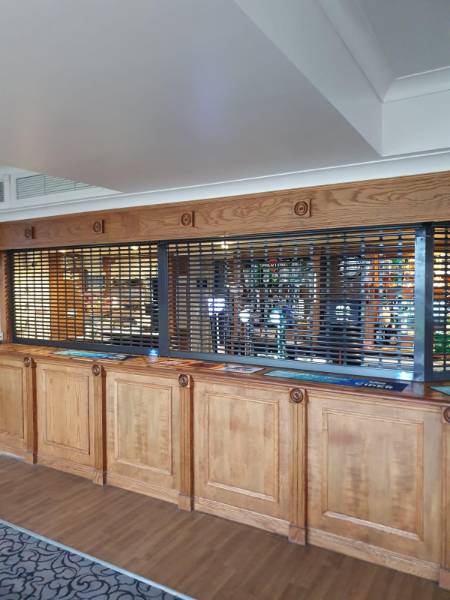 Protecting a timber bar without while keeping its historic character: K25 Shutters at Court Royal Hotel