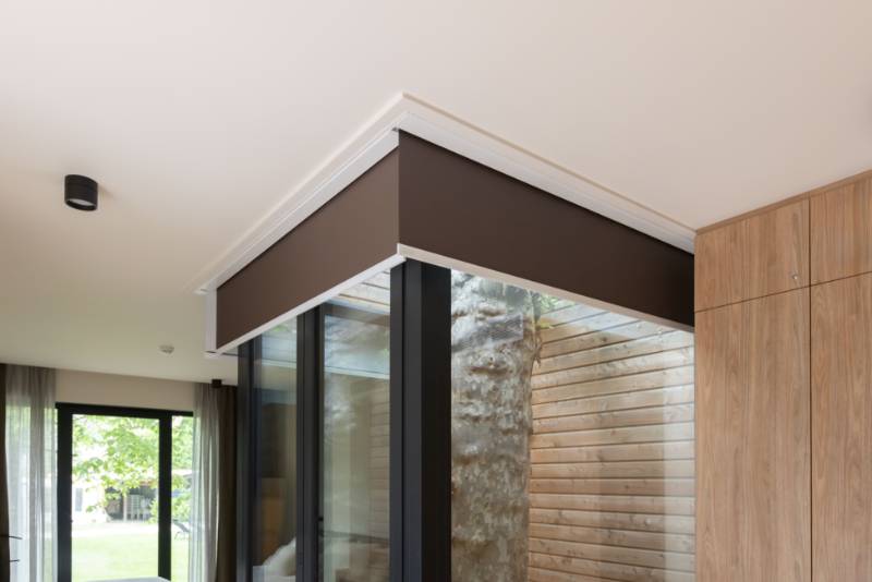 One Box and Premium Plus Roller Blinds in Preistoriche Green Lodge