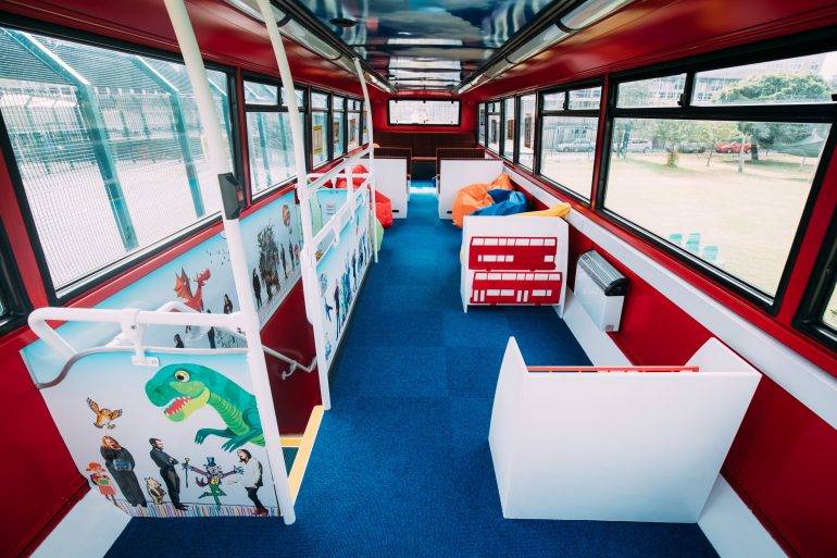 Tolworth Nursery - F. Ball help to transform double-decker bus into library for schoolchildren