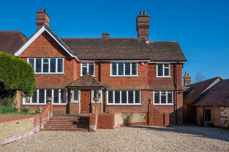 Traditional home refreshed with white replacement steel windows