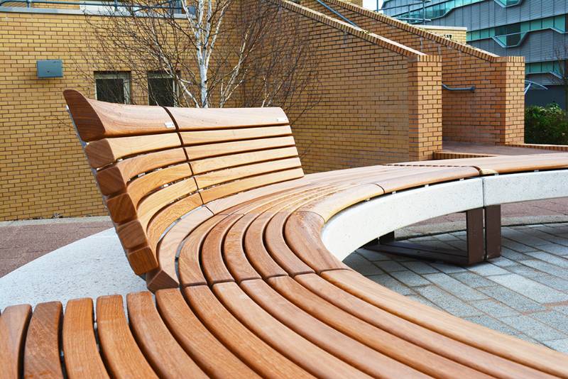 Curved timber and concrete Diamante Seating at Coventry University