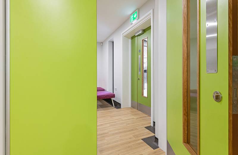 Vibrant Green decors chosen for doors throughout school