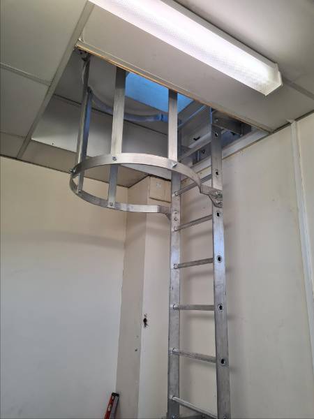 Permanently-fixed vertical ladder system - fixed access ladder to roof access hatch at Sheffield University Campus Building