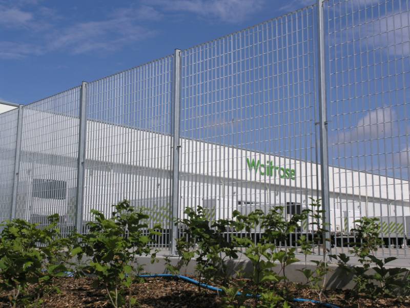 Waitrose Distribution: Roma-3 mild steel grating fence in a galvanized finish was specified for the boundary demarcation.