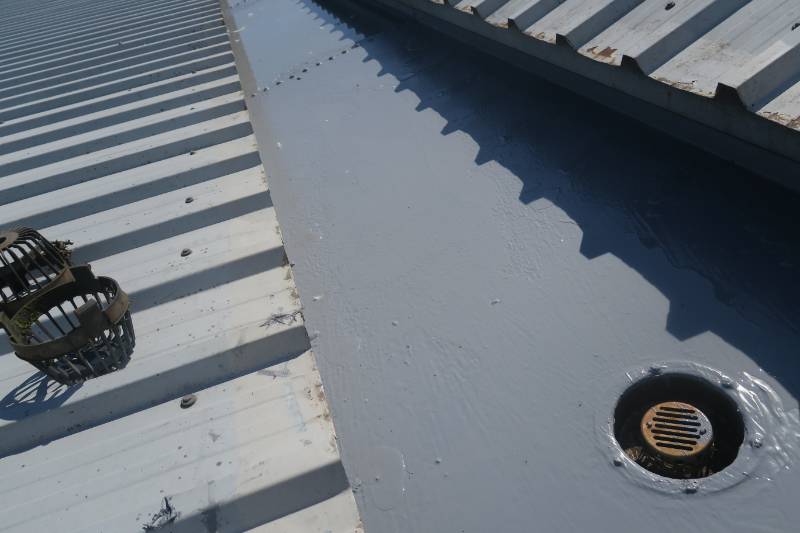 Liquid gutter lining project using Liquasil Gutterseal system on metal gutter