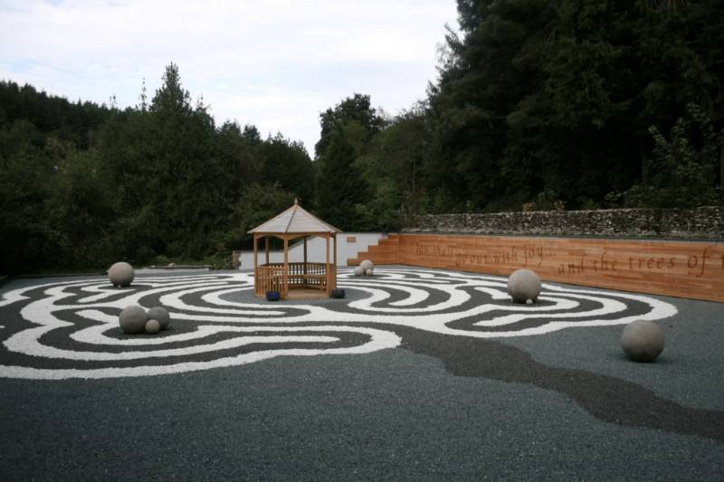 Gravelrings overlays tennis court to create a beautiful gravel labyrinth