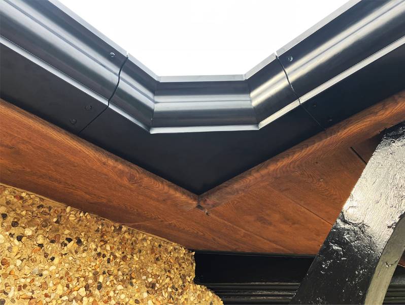 Ogee Gutter with wide valley angle resolves overshoot issues