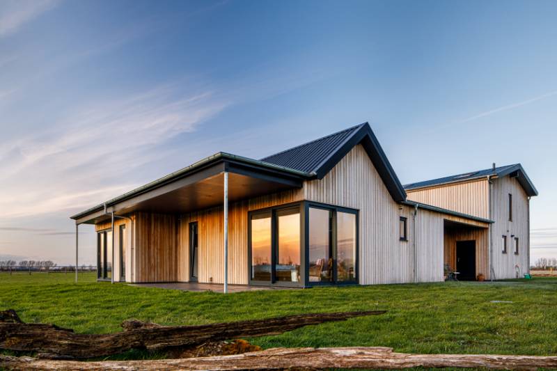 Factory coated Larch cladding