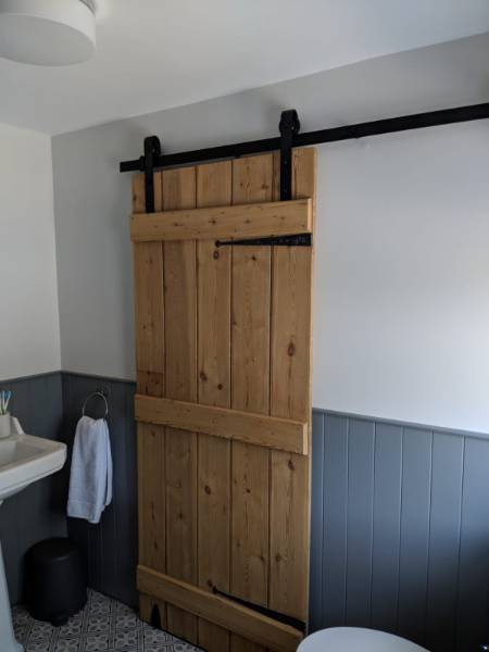 P C Henderson’s Rustic Sliding Barn Door Hardware Used in Home Renovation