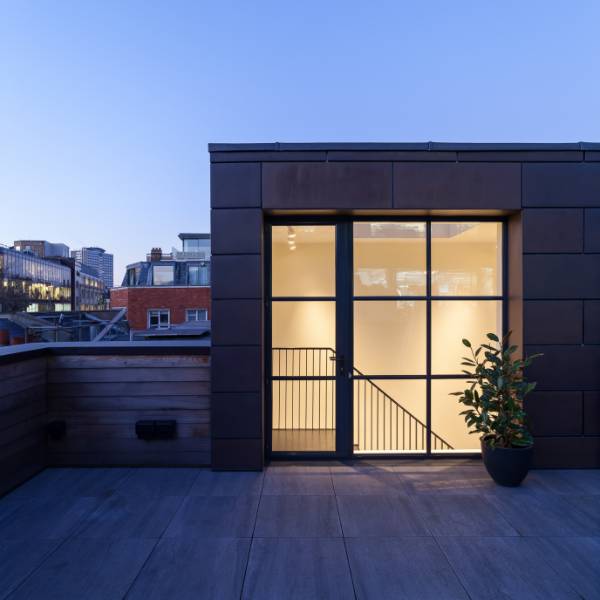 Historical industrial space sympathetically transformed into a family dwelling with new steel windows and doors