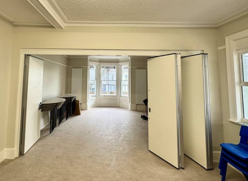 Stylefold Hinged sliding folding acoustic moveable wall - Hastings and Bexhill Mencap Society